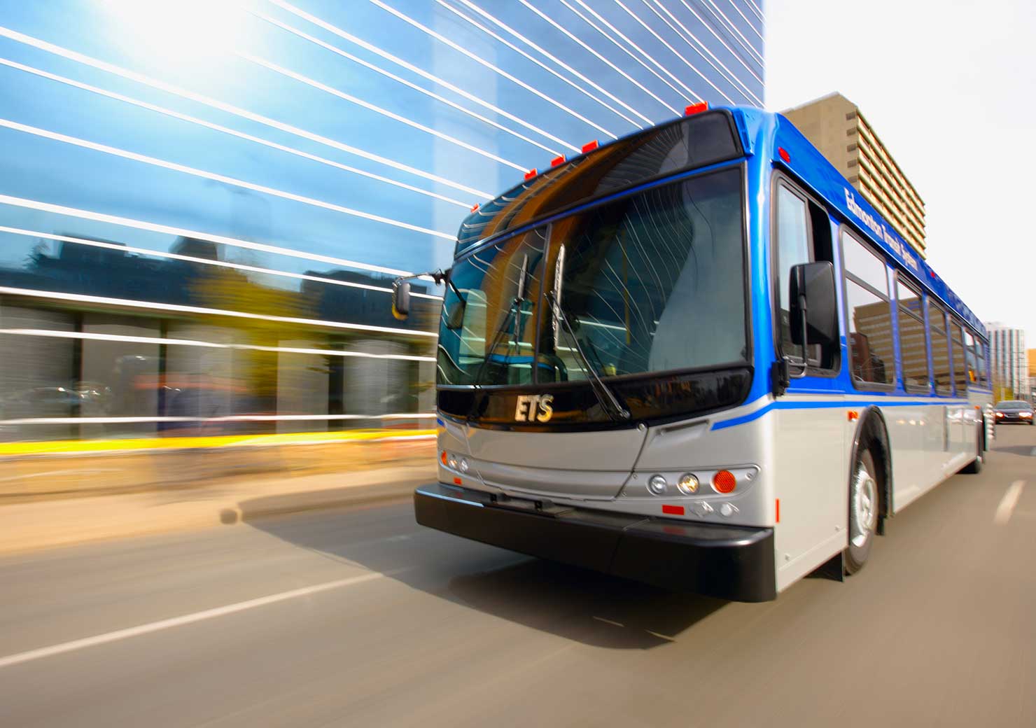 ETS bus moving swiftly through the city, demonstrating safe and efficient transit solutions by ExceleRATE.