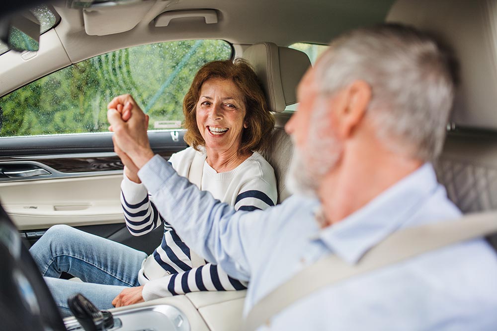 Senior couple enjoying a safe drive, emphasizing DriveABLE’s commitment to enhancing senior driving safety.