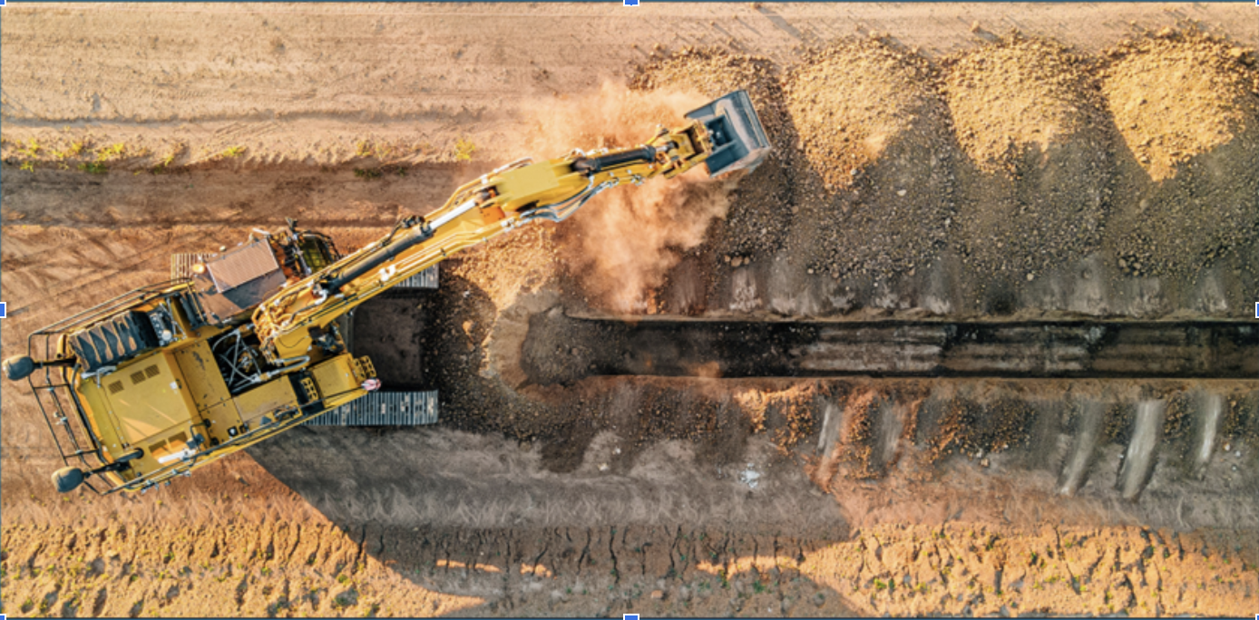 Top-down view of an excavator digging at a construction site. Neurapulse’s quick assessment tools support safety in heavy equipment operations.